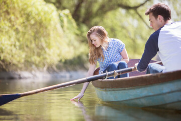 Couple in rowboat on river