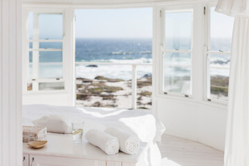 Fototapeta na wymiar White bedroom overlooking ocean