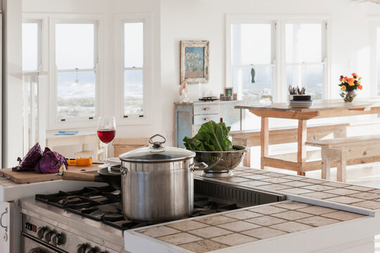 Vegetables And Glass Of Wine In Kitchen