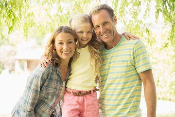 Fototapeta premium Family smiling together outdoors