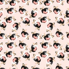 Seamless pattern with heads of cute cows on a pink background. Pets. Large horned animals. Stock vector illustration for fabrics, bedding and baby linen, wrapping paper, wallpaper and other decor