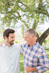 Fototapeta premium Father and son hugging outdoors