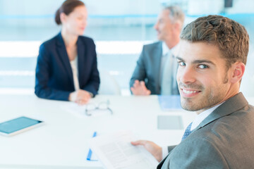 Portrait of confident businessman in conference room