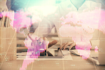 Double exposure of business theme sketch hologram and woman holding and using a mobile device.