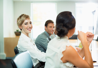 Fototapeta na wymiar Businesswoman smiling in meeting