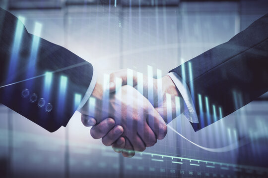 Double exposure of forex graph hologram and handshake of two men. Stock market concept.