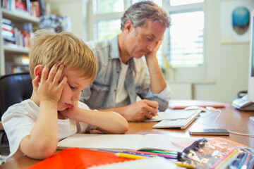 Fototapeta premium Father and son working in home office
