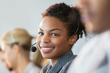 Businesswoman wearing headset in office