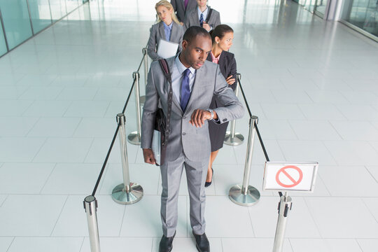 Businessman Waiting In Line