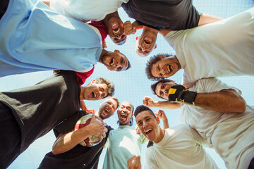 Men cheering together outdoors