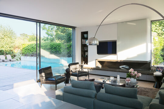 Modern Living Room Overlooking Patio With Swimming Pool