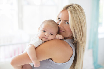 Fototapeta na wymiar Mother holding baby girl