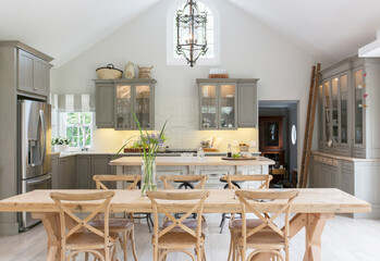 Fototapeta na wymiar Wooden dining table in luxury kitchen