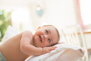 Obraz na płótnie Canvas Baby boy leaning on pillow