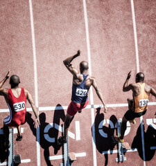 Sprinters taking off from starting block