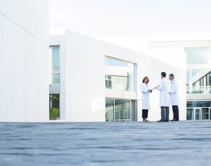Doctors talking on rooftop