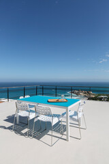 Table on patio overlooking ocean