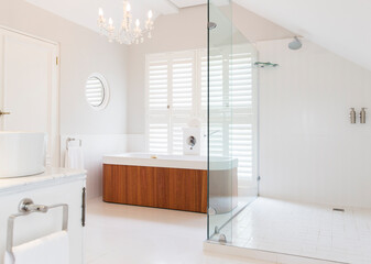 Fototapeta na wymiar Chandelier over soaking tub in modern bathroom