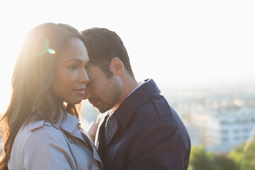 Couple hugging outdoors