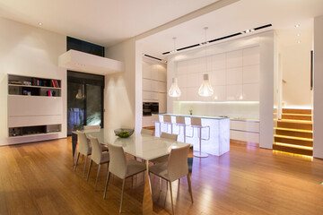 Dining area and kitchen in modern house