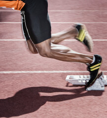 Runner taking off from starting block