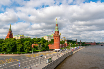 Obraz premium View to the Moscow Kremlin next to the river at cloudy day, summer time shot. Historical heritage of Russia. 