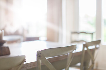 Close up of chairs at dining room table