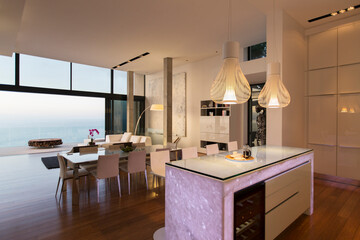 Modern kitchen and living area overlooking ocean