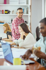 People working at conference table in office