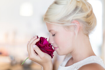 Woman smelling rose