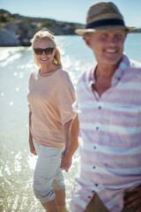 Couple walking in water together