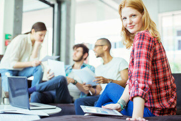 People using digital tablet in office