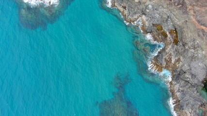 look at the sea from the cliffs next to the mountains