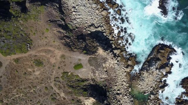 Overhead Aerial footage drone view over Tunquen Beach, Valparaiso region, an awesome beach with a lot of wildlife birdwacthing in it wetlands and turquoise waters, an idyllic and wild destination