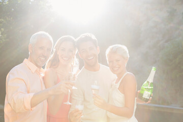 Friends toasting each other with champagne