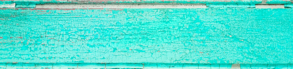 Obraz premium Cracked painted blue teal board with texture and grunge finish