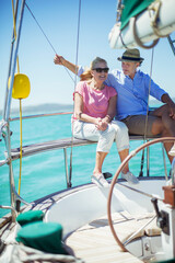 Couple sitting in boat together on water 