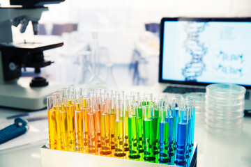 Rack of test tubes with solution on counter in lab