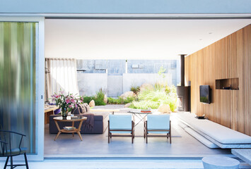 Sliding glass door opening to modern living room