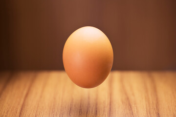 Close up of egg hovering over counter 