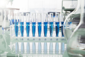 Rack of test tubes with solution on counter in lab