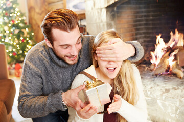 Couple exchanging gifts on Christmas
