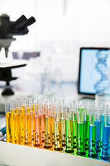 Rack of test tubes with solution on counter in lab