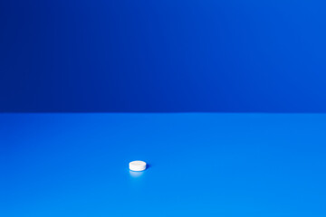 Close up of prescription pill on blue counter