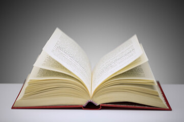 Close up of open book on counter