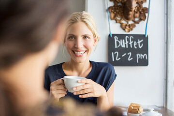 Women having coffee together in cafe