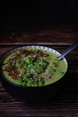 Pea soup on wooden background