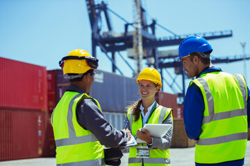 Business people and worker talking near cargo containers