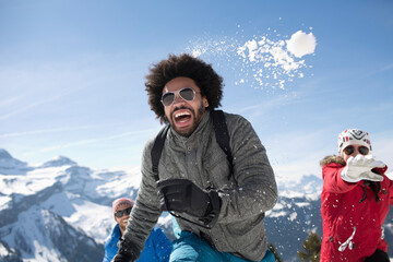 Friends enjoying snowball fight