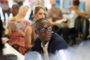 University student listening to IT seminar, students sitting 